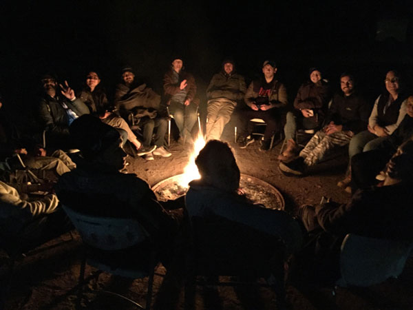 Students reflecting over a campfire in Nukunu Country.