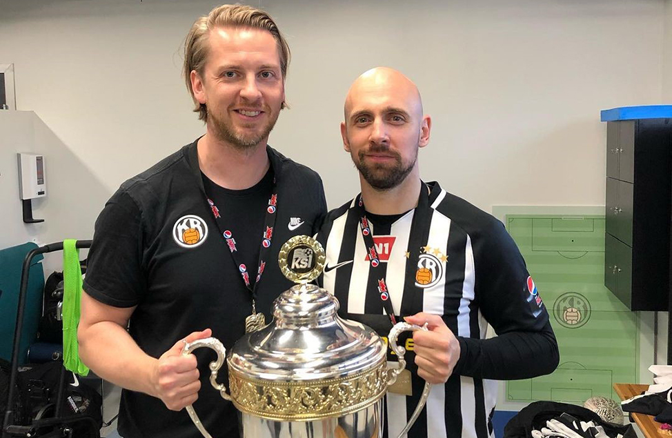 physiotherapist Valgeir Viðarsson holding 2019 Úrvalsdeild Icelandic Championship cup with team member