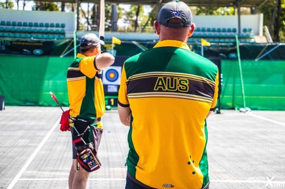 Darren Peters, with his competitors red shirt, competing in the 20218 Sydney Invictus Games where he won gold in archery.