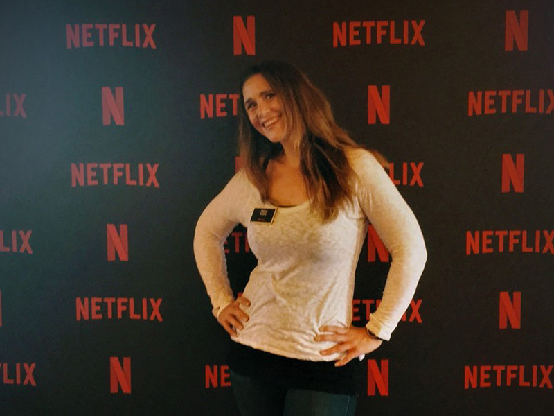 Phillapa Avery in front of a Netflix media screen