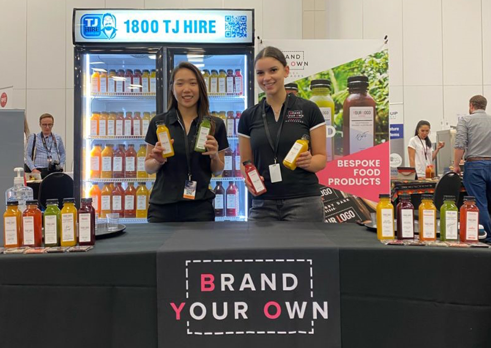 Taste Studios Marketing Coordinator and BYO Foods Founder, Charmain Ooi, showcasing their newest development bespoke, cold pressed juices.