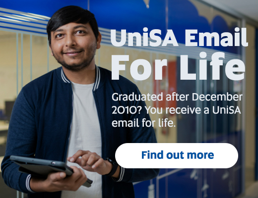Graduate with his laptop. Text overlay UniSA Email for life. Graduated after December 2010? You receive a UniSA email for life. Find out more.