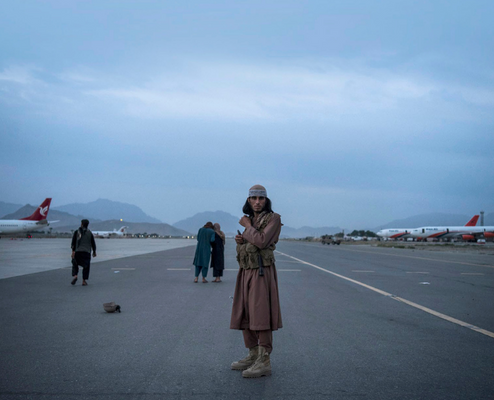 August in Kabul Book Cover, showing August 31, 2021, at Hamid Karzai International Airport as Taliban fighters from across Afghanistan explored the airfield 18 hours after the last US troops departed.