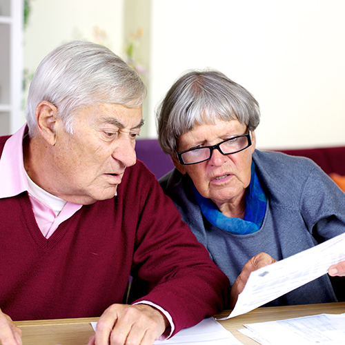 Older people looking at bills