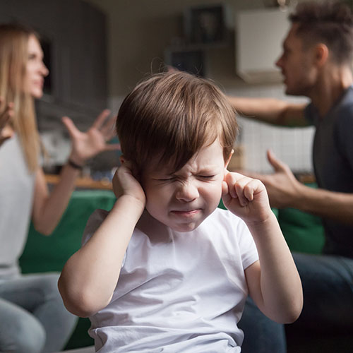 child blocking out parents arguing