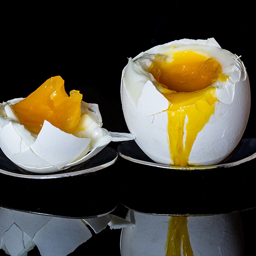 two boiled eggs in egg cups