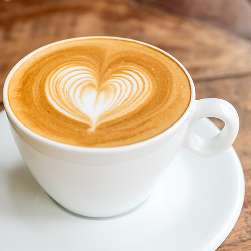 Coffee with heart drawn in coffee foam
