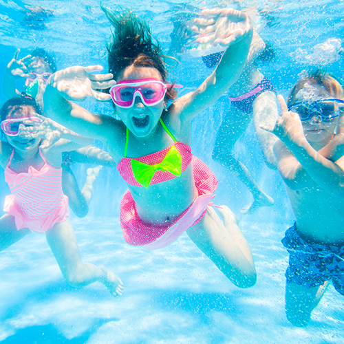 kids swimming underwater