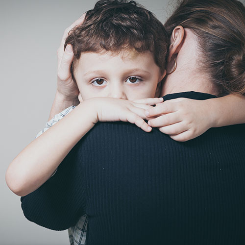 boy hugging parent shutterstock_337104815_web.jpg