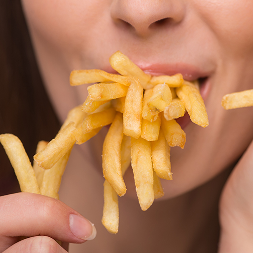girl eating fries