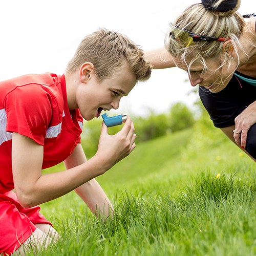 Teenage boy struggling with asthma