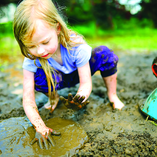 YoungGirlPlayingInMud_shutterstock_1021240567_web.jpg