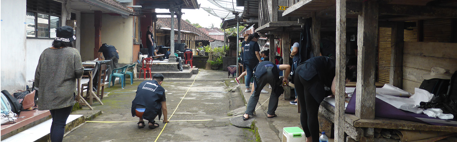 Participants measuring up for drawing in the family compound at Desa Pedawa