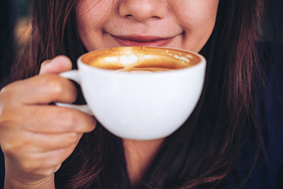 woman drinking a cup of coffee