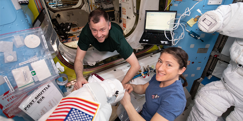 NASA astronauts Nick Hague and Christina Koch work on US spacesuits in the Quest airlock before embarking on a series of spacewalks on the International Space Station. The spacesuits of the future could be embedded with technology developed by UniSA researchers. Image courtesy NASA.