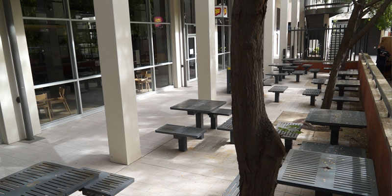 Empty chairs outside closed cafe