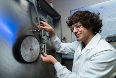 Mr Plowman, an international intern student, testing the wear resistance of materials. Photo by Juan van Staden.