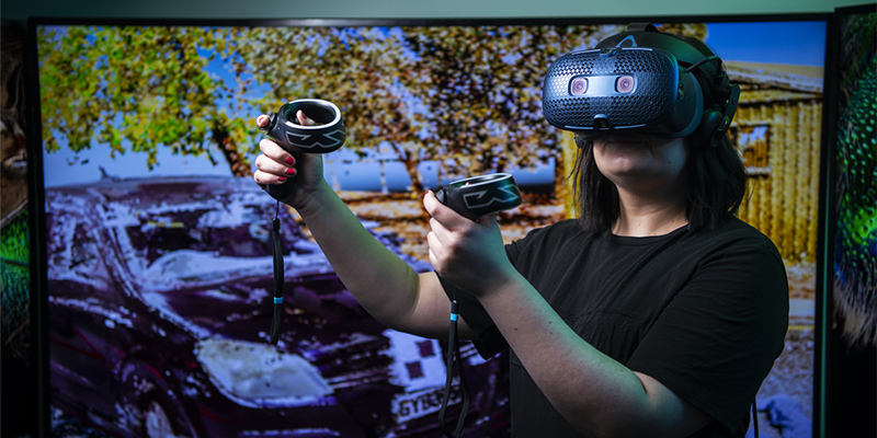 Man wearing VR goggles. Photo by Australian Research Centre for Interactive and Virtual Environments 