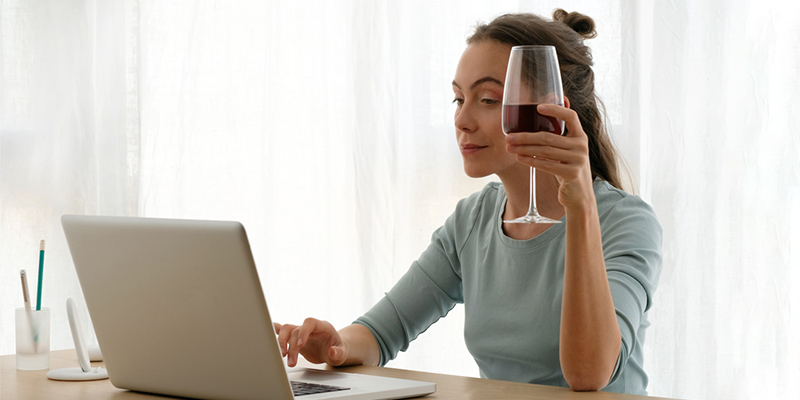 Woman drinking wine in lock down