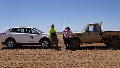 Dr Kate Gunn (right) with a farmer.