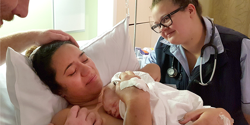 Jo Stephens with newborn Evren and UniSA midwifery student Taryn Gartner.