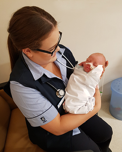 Midwifery student Taryn Gartner with Evren in neonatal care.
