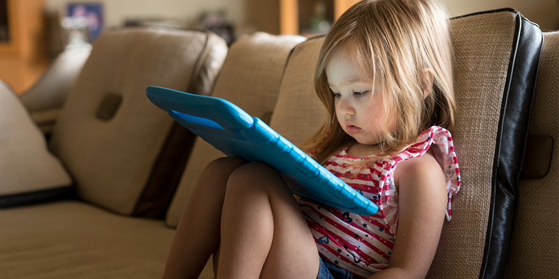 Young child watching screen 