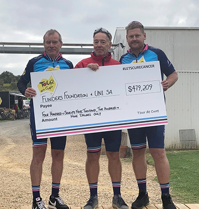 UniSA Senior Advancement Executive Paul Finn, Tour de Cure Grants Committee Chair Paul Mirabelle, and Flinders Foundation Executive Director Ross Verschoor, receiving a check on the last day of the 2021 SA Discovery Tour with total fundraising at that point.