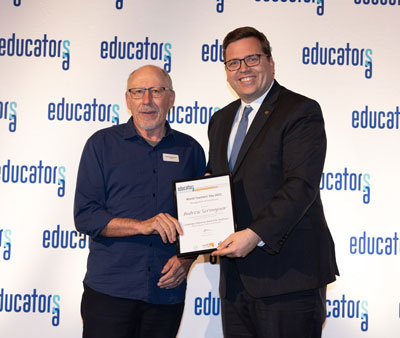 Lecturer Andrew Scrimgeour receiving his award from South Australian Minister for Education John Gardner.  