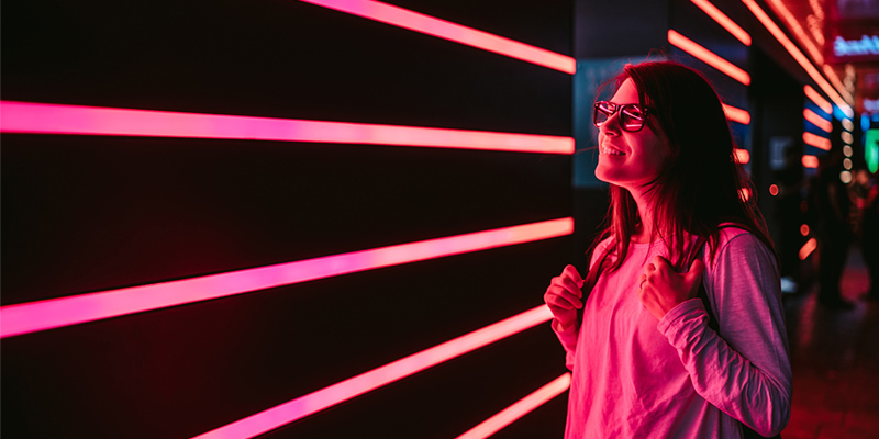 Woman near neon lighting