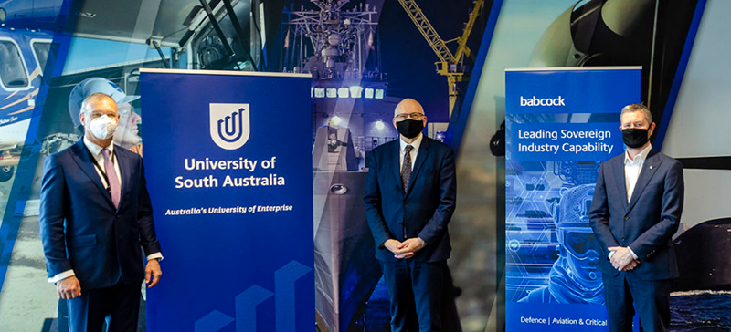 Babcock Australasia’s Chief Executive Officer David Ruff (left), Innovation and Skills Minister David Pisoni and UniSA Vice Chancellor Professor David Lloyd at the signing of the MoU at Babcock’s Regional Support Centre.