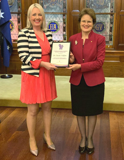 Dr Sarah Hattam receiving the Catherine McAuley Award from the South Australian Governor Frances Adamson AC.
