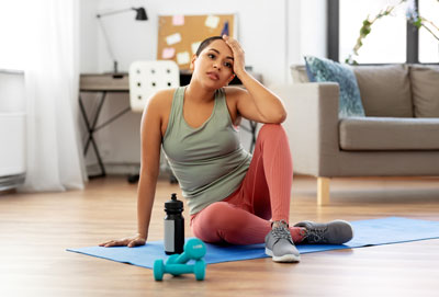 Person thinking about why you want to exercise can help your intrinsic motivation. Shutterstock