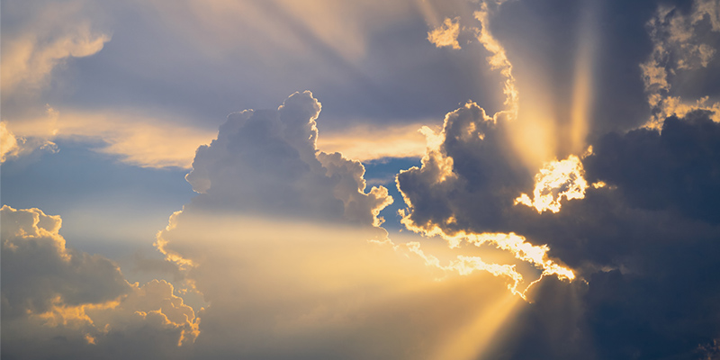 Sun streaming through clouds