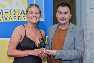 Winner of the Julie Duncan Memorial Award for Student Journalism Jessica Dempster with UniSA Creative Executive Dean Professor Craig Batty.