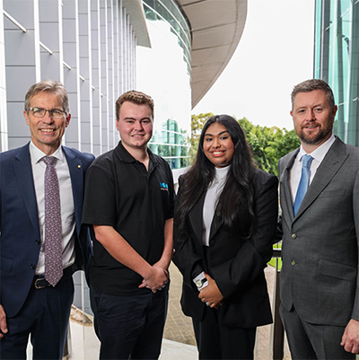 Vice Chancellors Professor Peter Høj and Professor David Lloyd are flanked by UniSA student Oliver Shephard-Bayly and University of Adelaide student Mahshiat Tahsin.